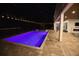 Stunning pool view at night with decorative lighting and poolside lounge area at 6713 Taneytown St, North Port, FL 34291