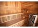 Luxurious wooden sauna featuring tiered seating and a traditional sauna heater at 6713 Taneytown St, North Port, FL 34291