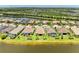 Aerial view of home on the water in a serene neighborhood with lush landscaping at 6756 Chester Trl, Lakewood Ranch, FL 34202