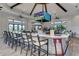 Enjoy drinks in this stylish bar with a large TV, ceiling fans, and plenty of natural light at 6756 Chester Trl, Lakewood Ranch, FL 34202