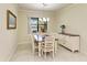 Dining room with a view of the lake, plus a sideboard for storage at 6756 Chester Trl, Lakewood Ranch, FL 34202