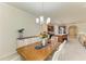 Charming dining area with views into the kitchen and living spaces at 6756 Chester Trl, Lakewood Ranch, FL 34202