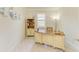 Bright home office featuring a white desk with shelving and nautical decor at 6756 Chester Trl, Lakewood Ranch, FL 34202