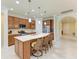 Modern kitchen featuring granite counters, a large island, and stainless steel appliances at 6756 Chester Trl, Lakewood Ranch, FL 34202