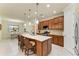 Spacious kitchen with a large island, granite countertops, and stainless steel appliances at 6756 Chester Trl, Lakewood Ranch, FL 34202