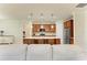 Open kitchen with island seating and seamless flow to the living area at 6756 Chester Trl, Lakewood Ranch, FL 34202