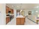 Open kitchen with a large island, granite counters, and stainless steel appliances at 6756 Chester Trl, Lakewood Ranch, FL 34202