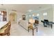 A well lit living room features tile flooring, lots of furniture, and a television at 6756 Chester Trl, Lakewood Ranch, FL 34202