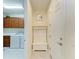 Mud room and laundry area featuring a bench with storage and a washer and dryer set at 6756 Chester Trl, Lakewood Ranch, FL 34202
