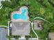 Aerial view of a community pool, playground, and green spaces, promoting an active lifestyle at 7314 Hamilton Rd, Bradenton, FL 34209