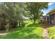 Expansive backyard with lush green grass and mature trees, providing a serene and private outdoor space at 7314 Hamilton Rd, Bradenton, FL 34209