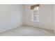 Bedroom featuring neutral carpet, window, and ample natural light at 7314 Hamilton Rd, Bradenton, FL 34209