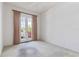 Bedroom featuring neutral carpet, French doors with access to the outside at 7314 Hamilton Rd, Bradenton, FL 34209