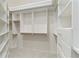 Walk-in closet featuring custom built-in shelving and drawers for optimal storage at 7314 Hamilton Rd, Bradenton, FL 34209