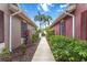 Gated walkway between homes with lush landscaping and privacy at 7314 Hamilton Rd, Bradenton, FL 34209