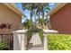 Charming gated entrance with lush landscaping and a peek at the neighborhood beyond at 7314 Hamilton Rd, Bradenton, FL 34209