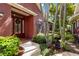 Inviting front entrance with a wreath-adorned door, surrounded by lush landscaping at 7314 Hamilton Rd, Bradenton, FL 34209