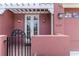 Charming front porch featuring a pergola and a wrought iron gate for security at 7314 Hamilton Rd, Bradenton, FL 34209