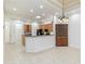 Kitchen area with wooden cabinets and large refrigerator at 7314 Hamilton Rd, Bradenton, FL 34209