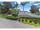 Community signage, with lush landscaping and trees at 7314 Hamilton Rd, Bradenton, FL 34209