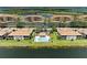 Aerial view of the community showcasing the pool, buildings, and lush landscaping at 7911 Grand Estuary Trl # 102, Bradenton, FL 34212
