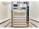 Walk-in closet with built-in shelving and drawers, providing ample and organized storage space at 7911 Grand Estuary Trl # 102, Bradenton, FL 34212