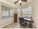 Bright home office with a desk, chair, and windows overlooking a lake view at 7911 Grand Estuary Trl # 102, Bradenton, FL 34212