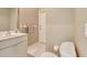 Bathroom featuring tile floors, toilet, and a vanity sink with cabinet at 8047 Desoto Woods Dr, Sarasota, FL 34243
