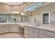 Bathroom with double sinks, a vanity, and a large mirror at 8047 Desoto Woods Dr, Sarasota, FL 34243