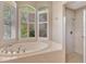Bathroom featuring a tub and shower at 8047 Desoto Woods Dr, Sarasota, FL 34243