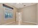 Bedroom with high ceilings, tiled floor, and plantation shutters at 8047 Desoto Woods Dr, Sarasota, FL 34243