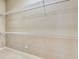 Walk in closet with built in white wire shelving at 8047 Desoto Woods Dr, Sarasota, FL 34243