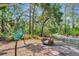 Picturesque wood bench next to butterfly information sign in lush outdoor walking trail at 8047 Desoto Woods Dr, Sarasota, FL 34243