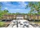 Community area featuring a wooden boardwalk with informational signs and lush greenery at 8047 Desoto Woods Dr, Sarasota, FL 34243
