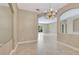 Dining area with tiled floors, chandelier, and natural light at 8047 Desoto Woods Dr, Sarasota, FL 34243