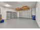 Spacious three car garage with overhead storage and epoxy painted floors at 8047 Desoto Woods Dr, Sarasota, FL 34243