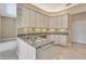 Bright kitchen featuring granite countertops, stainless steel appliances, and plenty of storage at 8047 Desoto Woods Dr, Sarasota, FL 34243