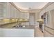 Kitchen boasts granite countertops, stainless steel appliances, and ample cabinet space at 8047 Desoto Woods Dr, Sarasota, FL 34243