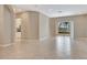 Spacious living room featuring tile floors and sliding glass doors to outdoor space at 8047 Desoto Woods Dr, Sarasota, FL 34243