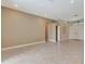 Open living room with tiled floor, neutral walls and archways at 8047 Desoto Woods Dr, Sarasota, FL 34243