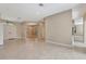 Open living room with tiled floor, neutral walls and archways at 8047 Desoto Woods Dr, Sarasota, FL 34243