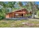 Picturesque covered wooden pavilion featuring picnic tables and convenient trash receptacles at 8047 Desoto Woods Dr, Sarasota, FL 34243