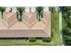 Overhead image displaying townhomes with tile roofs, manicured lawns, and serene pond views at 8224 Simpson Falls Ct # 8224, Sarasota, FL 34243