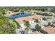 Aerial view of complex shows landscaping, lake, and surrounding neighborhood at 8224 Simpson Falls Ct # 8224, Sarasota, FL 34243