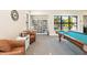 Billiard room with comfortable seating and a bookshelf for resident enjoyment at 8224 Simpson Falls Ct # 8224, Sarasota, FL 34243