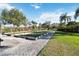 Picturesque bocce ball court framed by manicured landscaping, inviting outdoor recreation and leisure at 8224 Simpson Falls Ct # 8224, Sarasota, FL 34243