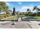 Picturesque bocce ball court framed by manicured landscaping, inviting outdoor recreation and leisure at 8224 Simpson Falls Ct # 8224, Sarasota, FL 34243
