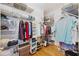 Organized walk-in closet with wire shelving, hanging rods, shoe racks, and storage for efficient storage at 8224 Simpson Falls Ct # 8224, Sarasota, FL 34243
