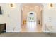 An inviting interior with tiled floors, hanging light fixtures, and a view to the exterior at 8224 Simpson Falls Ct # 8224, Sarasota, FL 34243