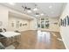 Community room with flexible table and chair arrangement, large windows, and wall art at 8224 Simpson Falls Ct # 8224, Sarasota, FL 34243